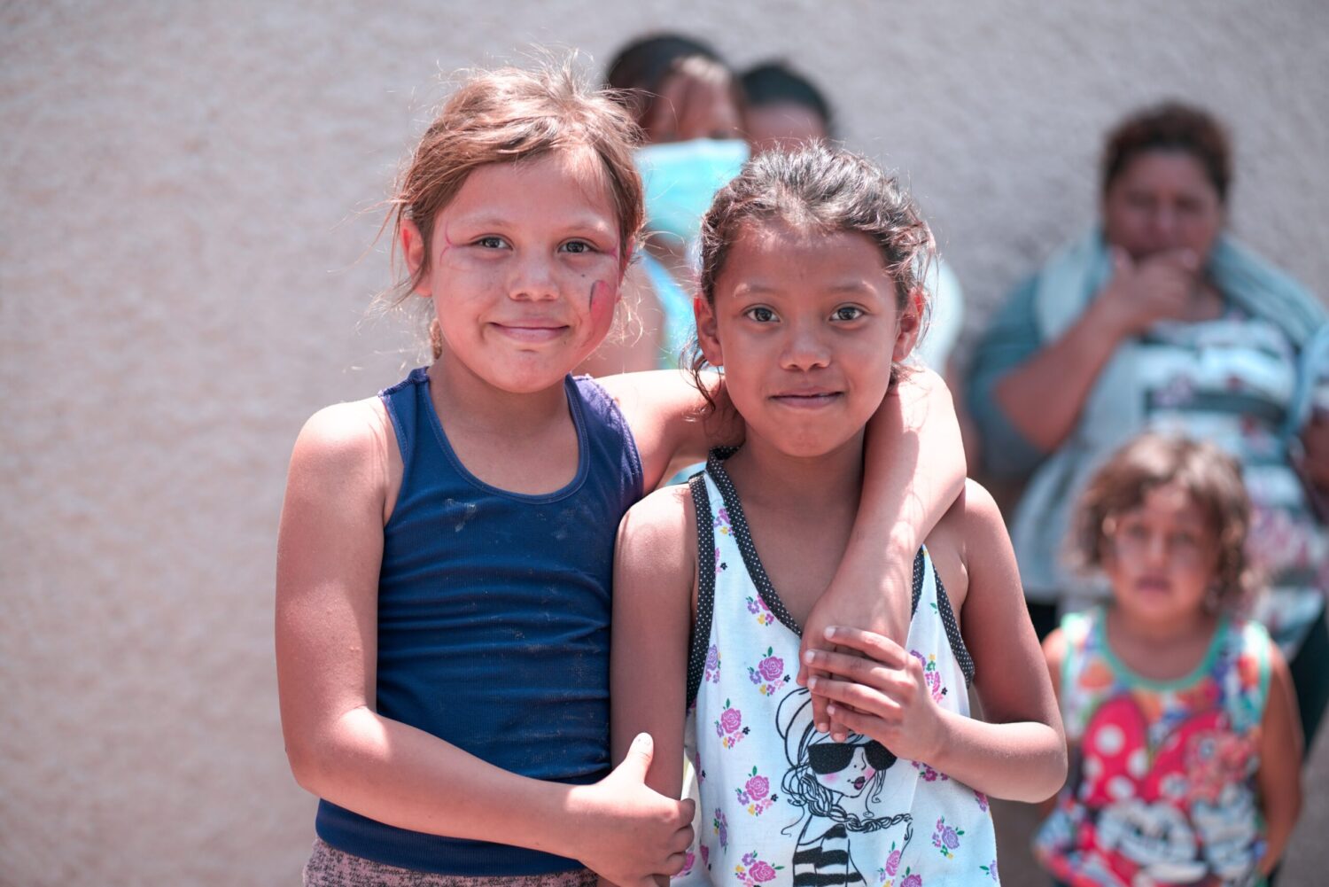 Two young girls who are Mexican migrants on the US border